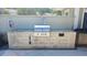 A community grill area features a stone surround cooking area with a stainless steel built-in grill at 5509 Cumberland Star Ct, Lutz, FL 33558