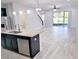 Open concept living room and kitchen with stainless steel appliances and island at 5509 Cumberland Star Ct, Lutz, FL 33558