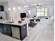 Open concept living room and kitchen with stainless steel appliances, island and breakfast bar at 5509 Cumberland Star Ct, Lutz, FL 33558