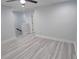 Spacious room with light gray flooring, white trim, and natural light at 5509 Cumberland Star Ct, Lutz, FL 33558