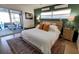 This bedroom features a king bed, an area rug and a sitting area to the left of the bed at 6337 Cocoa Ln, Apollo Beach, FL 33572