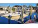 Boat on lift with dock and waterfront canal homes at 6337 Cocoa Ln, Apollo Beach, FL 33572