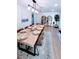 Bright dining room featuring modern light fixture, a large table, and stylish decor at 6337 Cocoa Ln, Apollo Beach, FL 33572