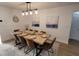 Bright dining room featuring modern light fixture, a large table, and stylish decor at 6337 Cocoa Ln, Apollo Beach, FL 33572