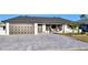 Charming home featuring a well-maintained brick driveway, attached garage, and manicured landscaping at 6337 Cocoa Ln, Apollo Beach, FL 33572