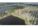 Beautiful aerial view of community with lakeside homes and lush landscaping at 6337 Shore Vista Pl, Apollo Beach, FL 33572