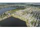 Scenic aerial view of community with lakeside homes and lush landscaping at 6337 Shore Vista Pl, Apollo Beach, FL 33572