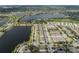 Expansive aerial view of a community with lakeside properties and manicured landscapes at 6337 Shore Vista Pl, Apollo Beach, FL 33572