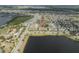 Community aerial view displays homes near lakeside with park area, playground, walking paths and lush landscape at 6337 Shore Vista Pl, Apollo Beach, FL 33572