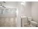 Bathroom featuring pedestal sink and toilet at 6337 Shore Vista Pl, Apollo Beach, FL 33572