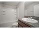 Bathroom featuring shower over tub, granite countertop, and white porcelain sink at 6337 Shore Vista Pl, Apollo Beach, FL 33572