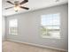 Bright bedroom with neutral walls and carpet flooring with ceiling fan at 6337 Shore Vista Pl, Apollo Beach, FL 33572