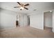 Bright bedroom with neutral walls and carpet flooring with ceiling fan and access to bathroom at 6337 Shore Vista Pl, Apollo Beach, FL 33572