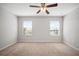 Bright bedroom with neutral walls and carpet flooring with ceiling fan at 6337 Shore Vista Pl, Apollo Beach, FL 33572