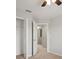 Bright bedroom with carpet and ceiling fan, view of open door with closet at 6337 Shore Vista Pl, Apollo Beach, FL 33572