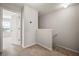 Upstairs hallway with neutral walls and carpet leads to bedrooms at 6337 Shore Vista Pl, Apollo Beach, FL 33572