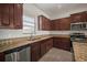 The kitchen features granite countertops, stainless steel appliances, and plentiful cabinet storage at 6337 Shore Vista Pl, Apollo Beach, FL 33572