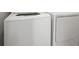 The white washer and dryer in a dedicated laundry area offer convenience and efficiency at 6337 Shore Vista Pl, Apollo Beach, FL 33572