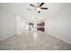 Open-concept living room and kitchen area with tile flooring at 6337 Shore Vista Pl, Apollo Beach, FL 33572