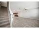 Bright, open-concept living space with tiled floors leading to a modern kitchen with stainless steel appliances at 6337 Shore Vista Pl, Apollo Beach, FL 33572