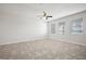 Bright living space featuring tile flooring and natural light from the windows at 6337 Shore Vista Pl, Apollo Beach, FL 33572