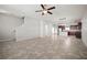 Open-concept living space featuring tile flooring and stair access at 6337 Shore Vista Pl, Apollo Beach, FL 33572