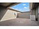A private outdoor patio features brick pavers and a shaded area for relaxing or entertaining at 6337 Shore Vista Pl, Apollo Beach, FL 33572