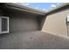 Private brick patio offers space for outdoor seating and entertaining at 6337 Shore Vista Pl, Apollo Beach, FL 33572