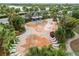 Overhead view of a fun-filled splash pad area with colorful water features and surrounding lounge chairs at 6337 Shore Vista Pl, Apollo Beach, FL 33572
