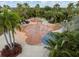 Entertaining splash pad with a variety of colorful water features and relaxing lounge chairs for parents at 6337 Shore Vista Pl, Apollo Beach, FL 33572