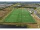 Aerial view of the expansive sports field with multiple activity areas in a vibrant community at 6337 Shore Vista Pl, Apollo Beach, FL 33572