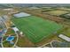 Aerial view of the expansive sports field with multiple activity areas and recreation areas at 6337 Shore Vista Pl, Apollo Beach, FL 33572