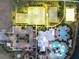 Aerial view of community's tennis and basketball courts, swimming pool, parking, and playground set next to a lake at 7209 Meeting House Ln, Apollo Beach, FL 33572