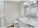 Bright bathroom featuring a marble countertop, modern fixtures, and a separate shower area for a spa-like experience at 7209 Meeting House Ln, Apollo Beach, FL 33572
