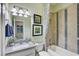 Bathroom featuring a shower-tub combination and granite vanity at 7209 Meeting House Ln, Apollo Beach, FL 33572