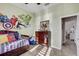 Bright bedroom featuring a themed wall mural and a comfortable twin bed at 7209 Meeting House Ln, Apollo Beach, FL 33572