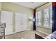 The bedroom has brightly colored accents, large windows, and closet at 7209 Meeting House Ln, Apollo Beach, FL 33572
