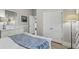 Bright bedroom with white furniture, and comfortable bedding at 7209 Meeting House Ln, Apollo Beach, FL 33572