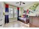 The bedroom is whimsically decorated with fun comic book and superhero themed wall art at 7209 Meeting House Ln, Apollo Beach, FL 33572