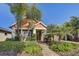 Charming home with beautiful landscaping, walkway, and tropical palm trees in front of the house at 7209 Meeting House Ln, Apollo Beach, FL 33572