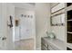 Hallway with custom built-ins and access to a closet at 7209 Meeting House Ln, Apollo Beach, FL 33572