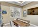 Comfortable home office space featuring modern desk, bright windows, and contemporary decor at 7209 Meeting House Ln, Apollo Beach, FL 33572