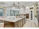 Spacious kitchen with a large island, stainless appliances, and an open concept design at 7209 Meeting House Ln, Apollo Beach, FL 33572