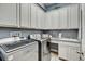 Well-equipped laundry room with modern appliances and ample counter space at 7209 Meeting House Ln, Apollo Beach, FL 33572
