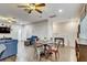 Open-concept living area with hardwood floors and bright lighting at 7209 Meeting House Ln, Apollo Beach, FL 33572