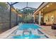 A stunning pool area with a built-in lounge area and lush greenery, ideal for relaxation and entertainment at 7209 Meeting House Ln, Apollo Beach, FL 33572