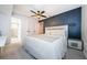 Cozy bedroom featuring a modern accent wall and ensuite bathroom at 7241 56Th N Ave, St Petersburg, FL 33709