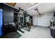 This garage features black accent walls and a complete weightlifting set up at 7241 56Th N Ave, St Petersburg, FL 33709