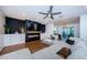 Spacious living room featuring a fireplace, large sectional sofa, and modern decor at 7241 56Th N Ave, St Petersburg, FL 33709