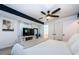 Bright main bedroom featuring modern ceiling fan, a TV on console, and ensuite bathroom access at 7241 56Th N Ave, St Petersburg, FL 33709